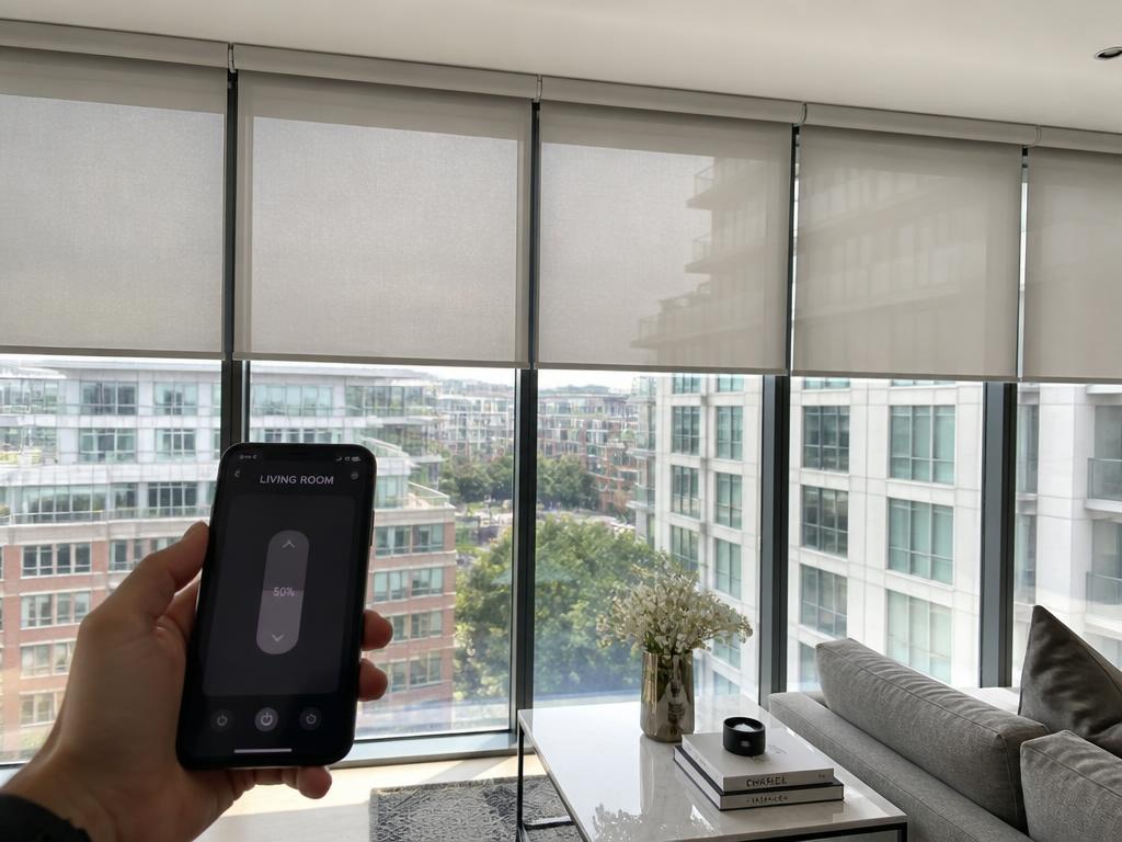 Motorised blinds lowering over floor-to-ceiling windows